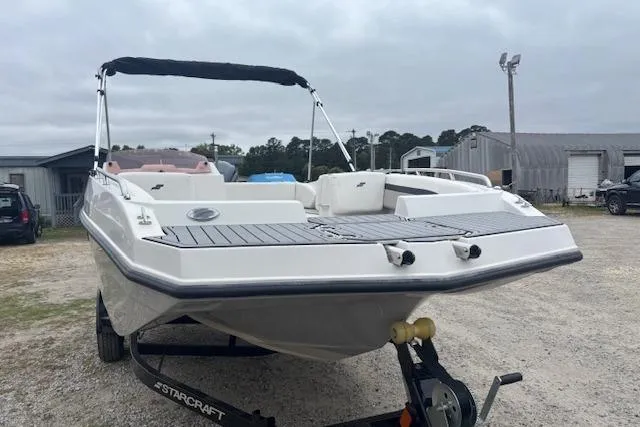 Slide: The Image of 2021 Starcraft SVX 171 OB boat on trailer, parked outdoors. - 6