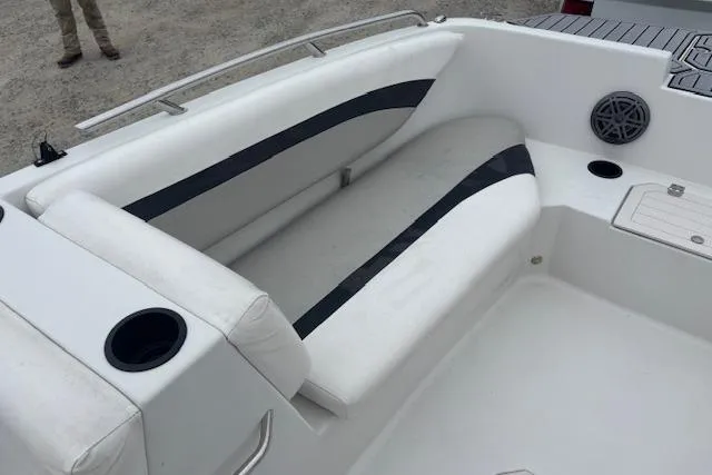 Slide: The Image of 2021 Starcraft SVX 171 OB boat interior with white seating and cup holders. - 9
