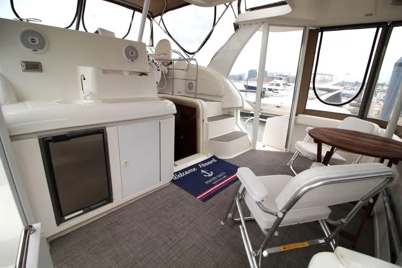 Slide: The Image of 2005 Cruisers Yachts 375 Motoryacht interior with seating, table, and kitchenette. - 11
