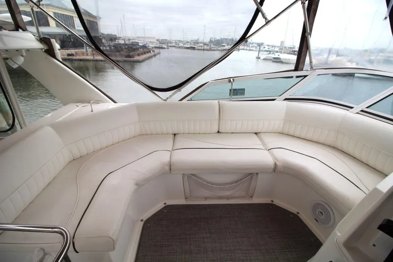 Slide: The Image of Luxurious seating area on 2005 Cruisers Yachts 375 Motoryacht with marina view. - 14