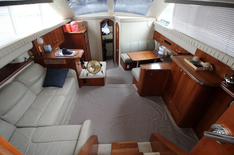 Slide: The Image of Luxurious interior of 2005 Cruisers Yachts 375 Motoryacht with elegant wood finishes and seating. - 18