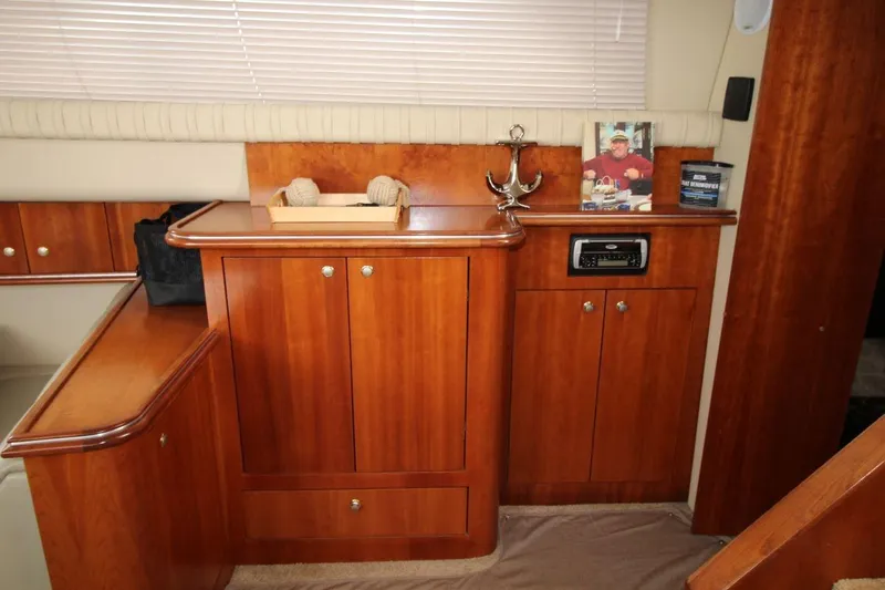 Slide: The Image of Interior of 2005 Cruisers Yachts 375 Motoryacht with polished wood cabinetry and decor. - 20