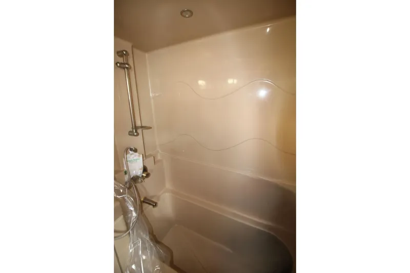 Slide: The Image of 2005 Cruisers Yachts 375 Motoryacht bathroom with beige shower and chrome fixtures. - 29