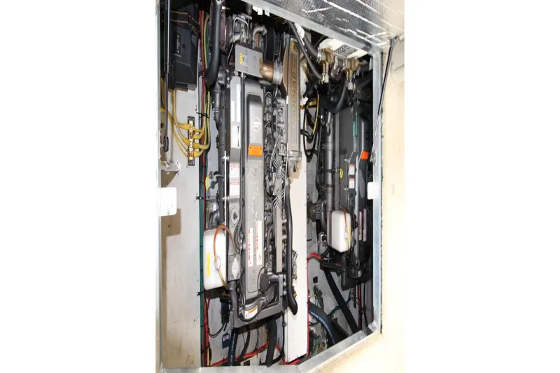 Slide: The Image of Engine compartment of 2005 Cruisers Yachts 375 Motoryacht, showcasing mechanical components. - 30