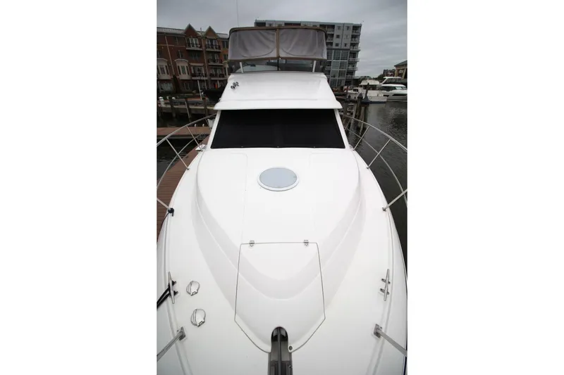 Slide: The Image of 2005 Cruisers Yachts 375 Motoryacht docked at marina, showcasing sleek design. - 9