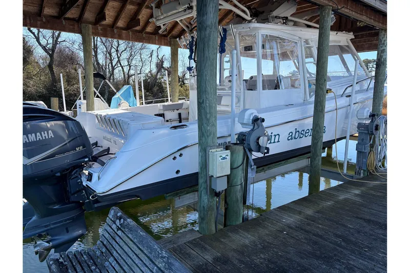 Slide: The Image of 2017 Everglades 350LX boat docked with Yamaha V8 engine. - 17