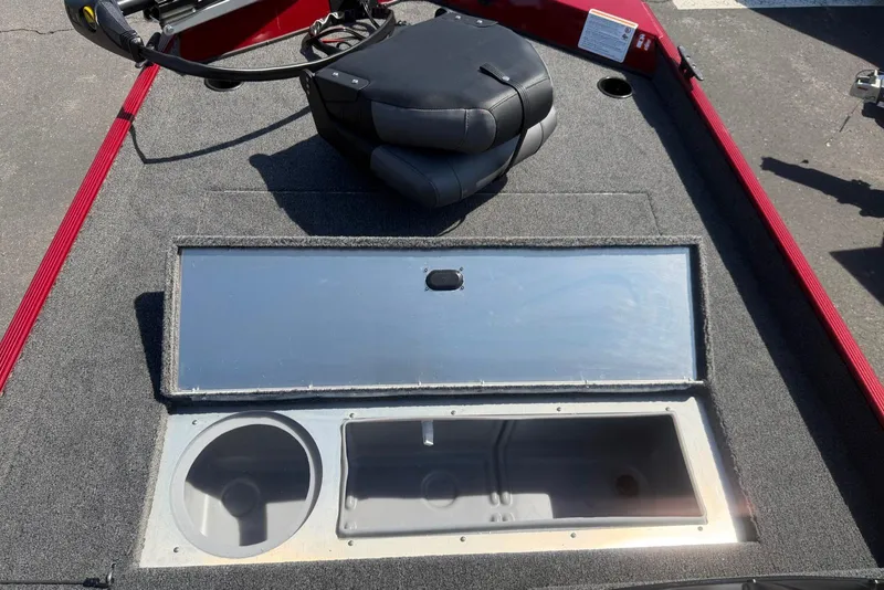 Slide: The Image of 2026 Crestliner 1700 Storm boat deck with storage compartments and seating. - 5