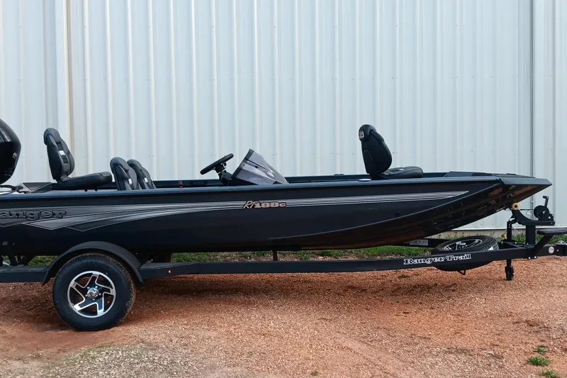 Slide: The Image of 2026 Ranger RT188C fishing boat on trailer, parked outdoors. - 19
