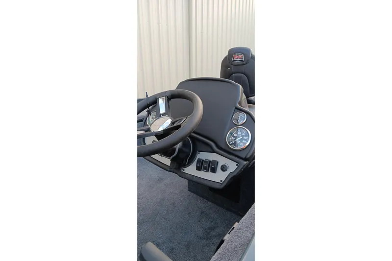 Slide: The Image of 2026 Ranger RT188C boat dashboard with steering wheel and gauges. - 3