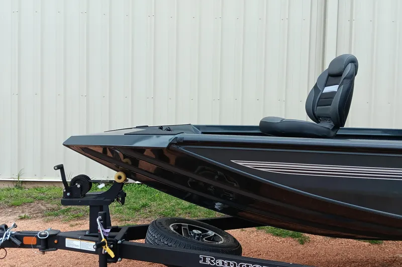 Slide: The Image of 2026 Ranger RT188C boat on trailer, featuring sleek design and comfortable seating. - 4