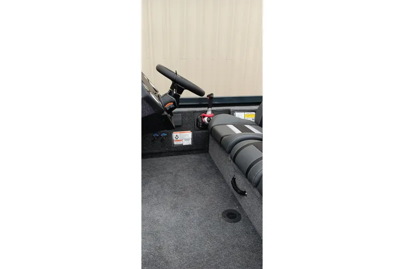 Slide: The Image of Interior of 2026 Ranger RT188C boat showing steering wheel and seating area. - 8