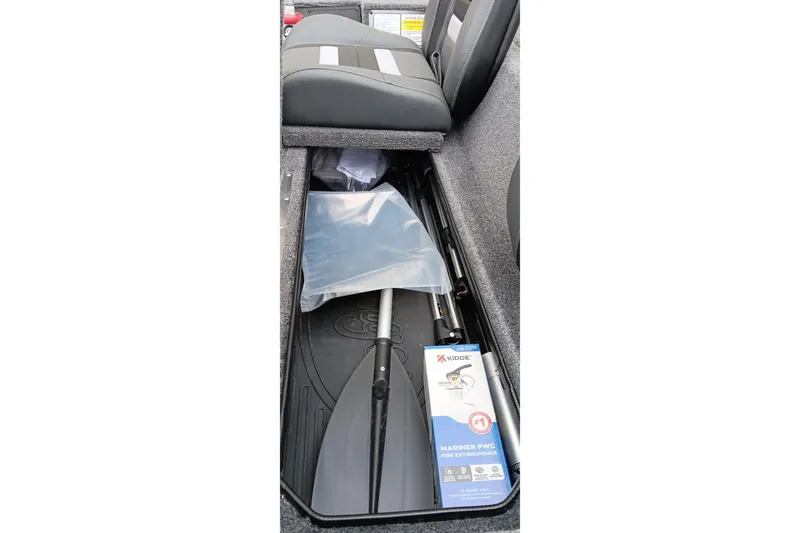 Slide: The Image of Storage compartment in 2026 Ranger RT188C boat with paddle and fire extinguisher. - 9