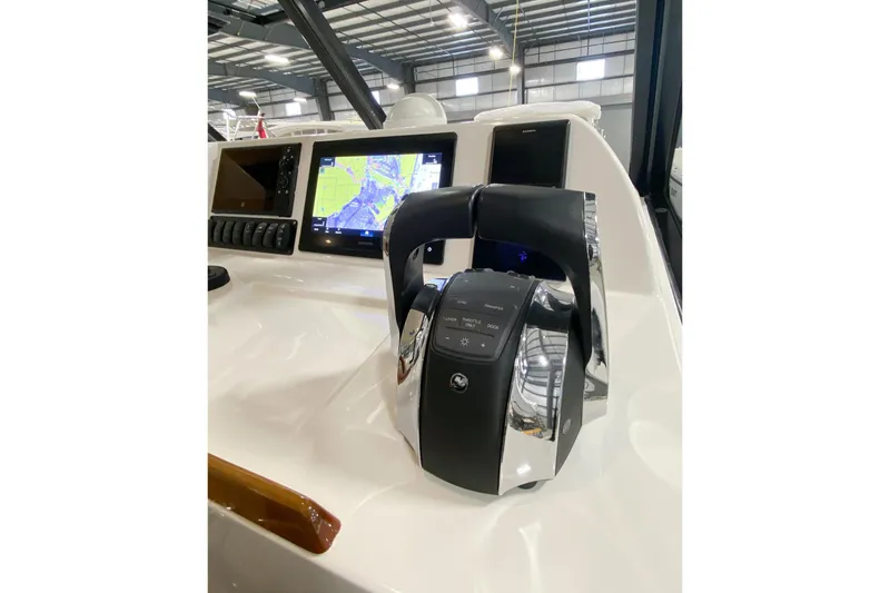 Slide: The Image of Control panel of 2022 MJM 3 boat with navigation display and throttle. - 51