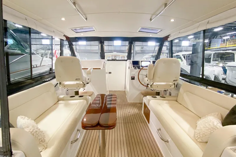 Slide: The Image of Interior of 2022 MJM 3 boat with luxurious seating and wooden flooring. - 54