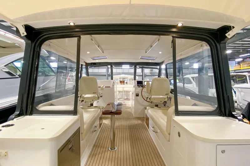 Slide: The Image of Interior view of 2022 MJM 3 boat with seating and steering area. - 55