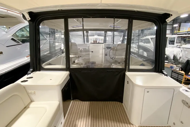 Slide: The Image of Interior view of a 2022 MJM 3 boat, showcasing seating and helm area. - 56
