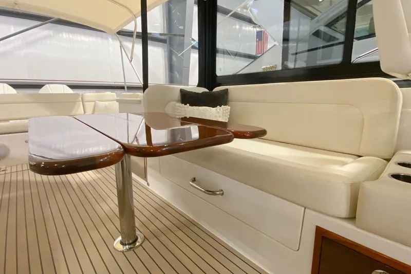 Slide: The Image of Luxurious interior of 2022 MJM 3 yacht with elegant seating and polished wooden table. - 60