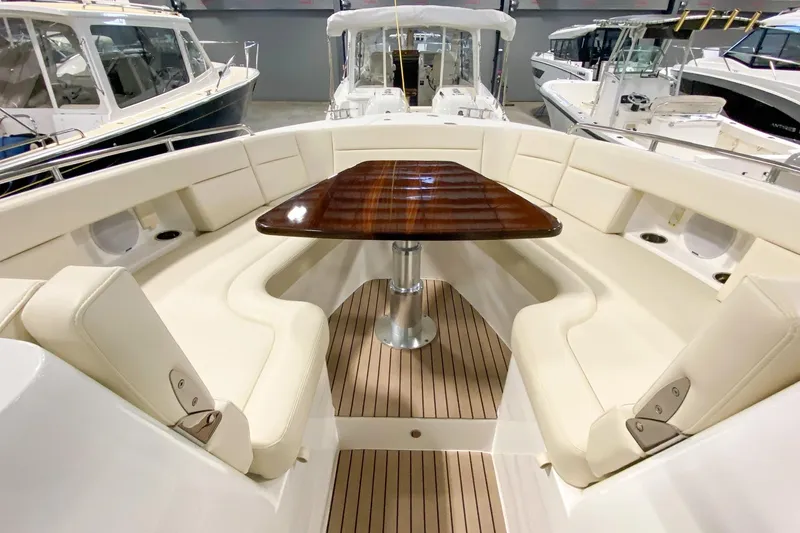 Slide: The Image of Luxurious 2022 MJM 3 boat interior with elegant seating and wooden table. - 68
