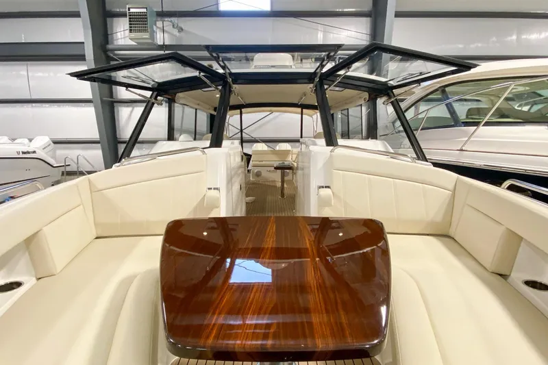 Slide: The Image of 2022 MJM 3 boat interior with elegant seating and polished wood table. - 69
