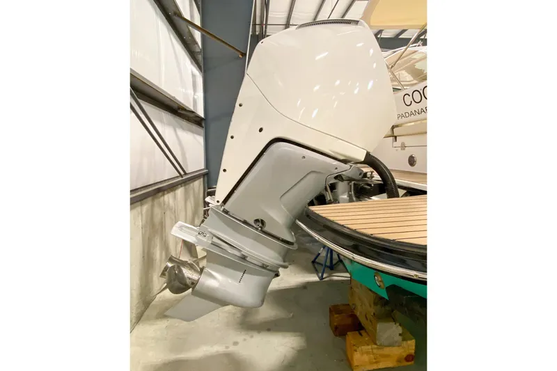 Slide: The Image of 2022 MJM 3 boat with outboard motor in storage facility. - 76