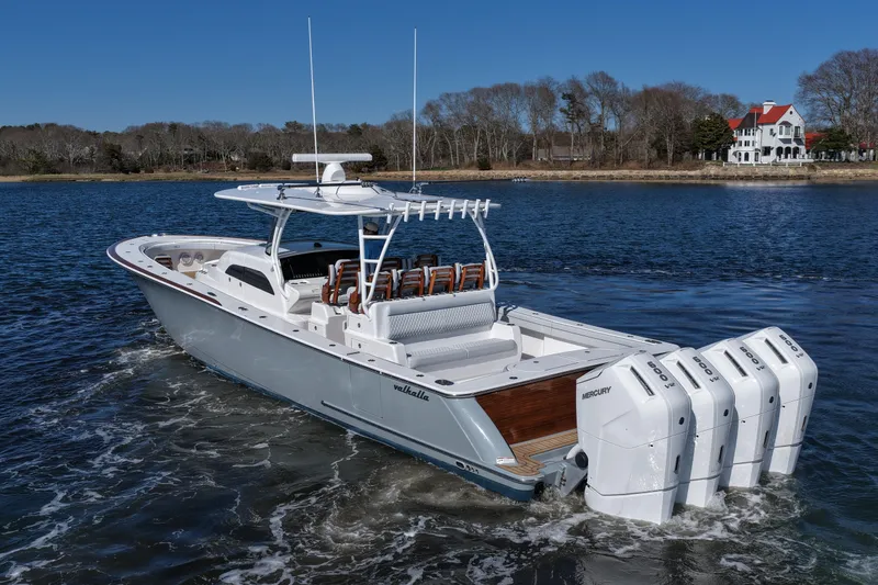 Slide: The Image of 2026 Valhalla Boatworks V-46 cruising on a serene lake with quad Mercury engines. - 10