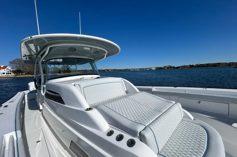 Slide: The Image of 2026 Valhalla Boatworks V-46 on calm water, showcasing sleek design and luxurious seating. - 25