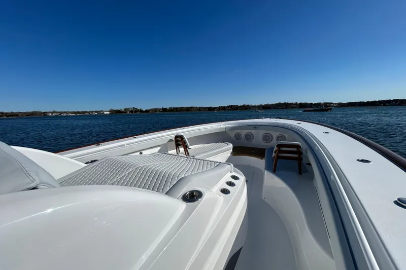 Slide: The Image of 2026 Valhalla Boatworks V-46 on calm water, showcasing sleek deck design and seating. - 26