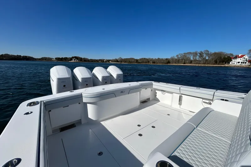 Slide: The Image of 2026 Valhalla Boatworks V-46 with quad engines on a serene waterway. - 30