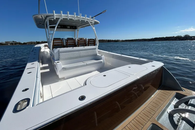 Slide: The Image of 2026 Valhalla Boatworks V-46 on water, showcasing sleek design and spacious seating. - 32