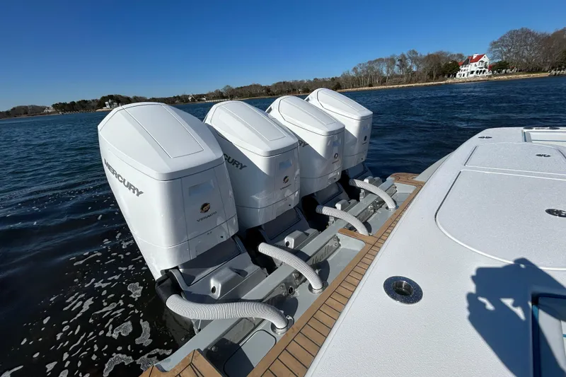 Slide: The Image of 2026 Valhalla Boatworks V-46 with four Mercury outboard engines on water. - 33