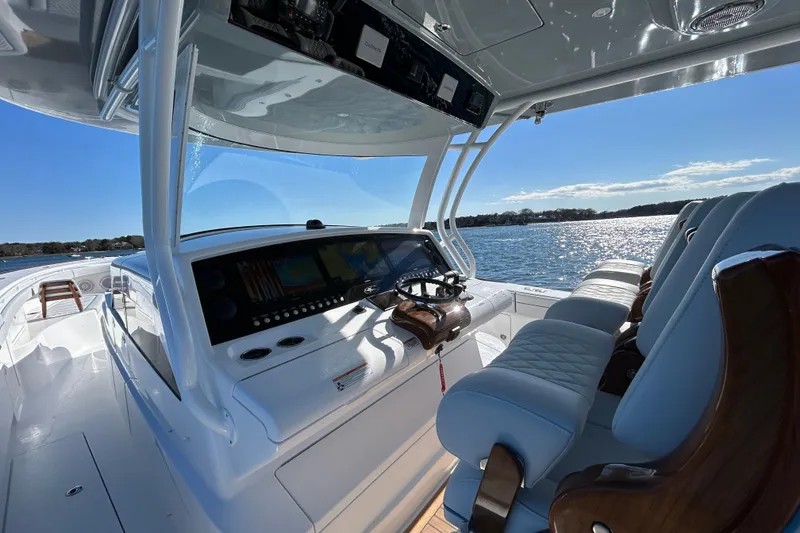 Slide: The Image of 2026 Valhalla Boatworks V-46 helm with luxurious seating and advanced navigation system. - 35