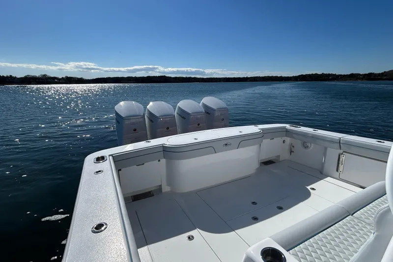 Slide: The Image of 2026 Valhalla Boatworks V-46 on water, showcasing spacious deck and quad engines. - 37