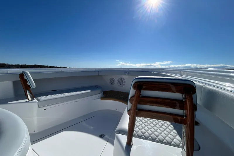 Slide: The Image of Luxurious 2026 Valhalla Boatworks V-46 interior under bright sun, showcasing elegant seating. - 40