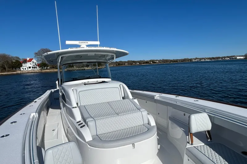 Slide: The Image of 2026 Valhalla Boatworks V-46 on calm water, showcasing sleek design and luxurious seating. - 43