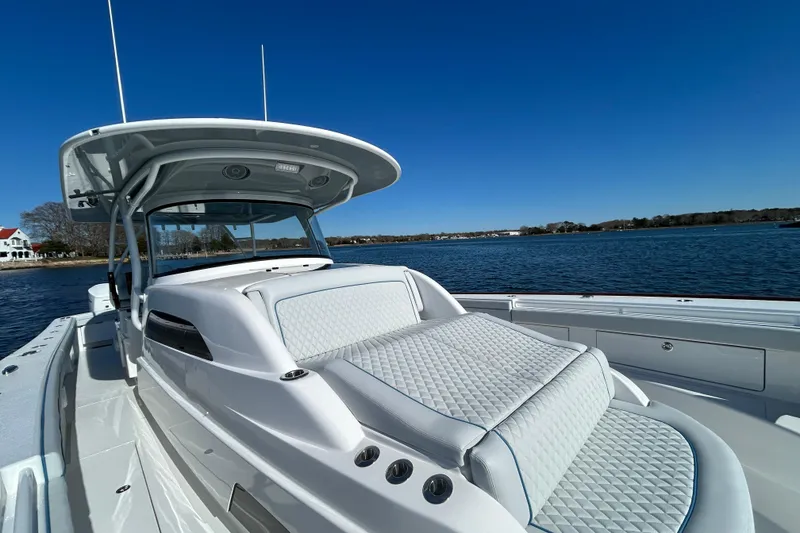 Slide: The Image of 2026 Valhalla Boatworks V-46 on calm water, showcasing sleek design and luxurious seating. - 44