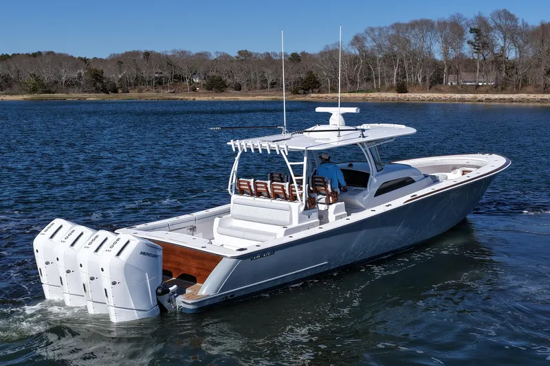 Slide: The Image of 2026 Valhalla Boatworks V-46 cruising on a serene lake with quad Mercury engines. - 8