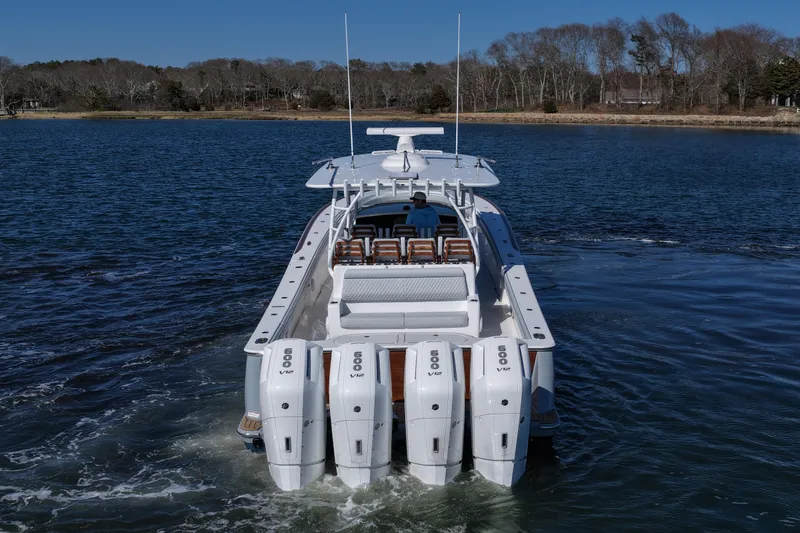 Slide: The Image of 2026 Valhalla Boatworks V-46 with quad engines cruising on a serene lake. - 9