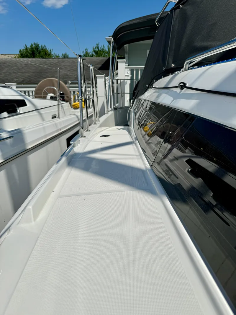 Slide: The Image of Deck of Jeanneau Sun Odyssey 380, 2023 model, docked at marina. - 11