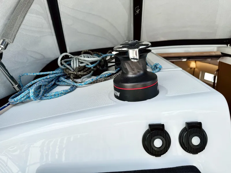 Slide: The Image of Jeanneau Sun Odyssey 380, 2023, featuring winch and ropes on deck. - 16