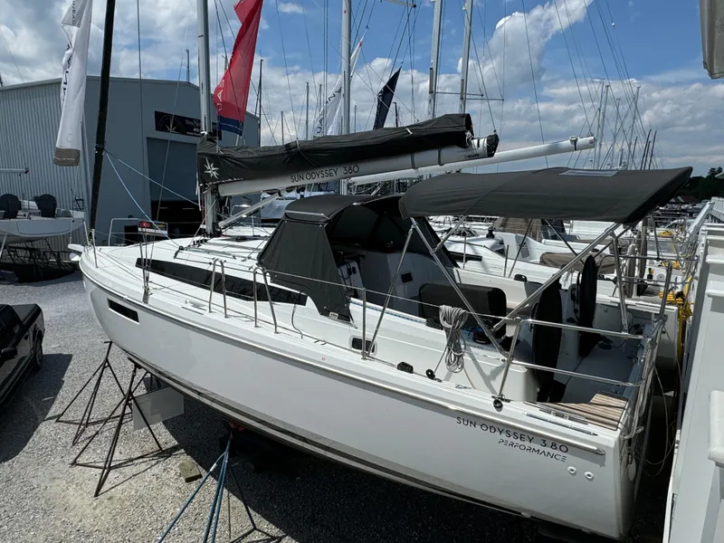 Slide: The Image of 2023 Jeanneau Sun Odyssey 380 sailboat docked at marina. - 2
