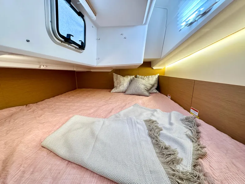 Slide: The Image of Interior of Jeanneau Sun Odyssey 380, 2023, featuring a cozy bed. - 28