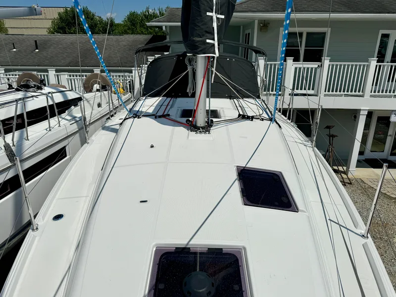Slide: The Image of Jeanneau Sun Odyssey 380 sailboat deck, 2023 model, docked at a marina. - 7
