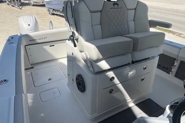 Slide: The Image of 2026 World Cat 280 CC-X boat interior with cushioned seating and storage compartments. - 5