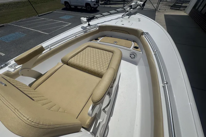 Slide: The Image of 2025 Sportsman Masters 247OE Bay Boat with tan seating and spacious deck. - 14