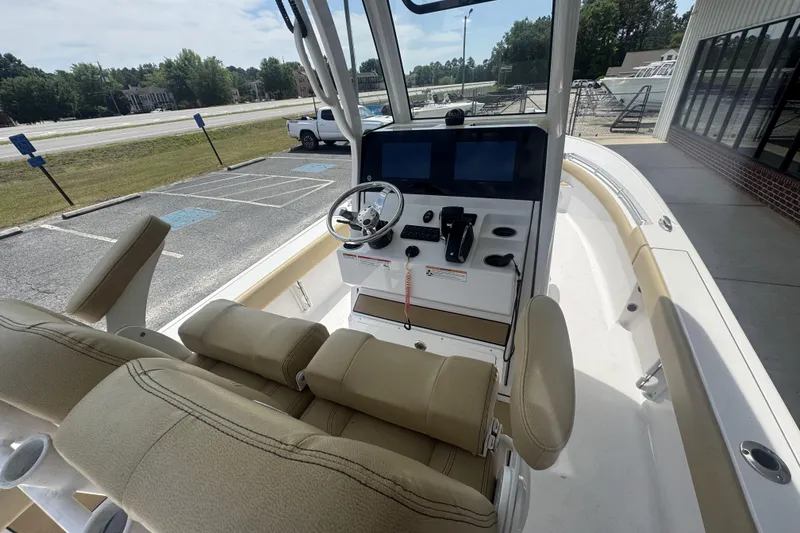 Slide: The Image of 2025 Sportsman Masters 247OE Bay Boat interior with helm and seating. - 21