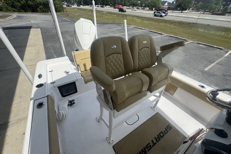 Slide: The Image of 2025 Sportsman Masters 247OE Bay Boat interior with dual tan seats and steering console. - 22