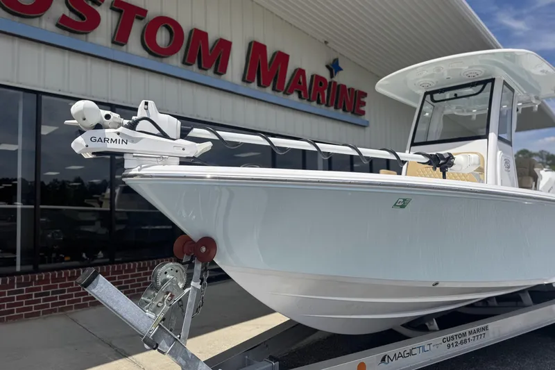 Slide: The Image of 2025 Sportsman Masters 247OE Bay Boat displayed at Custom Marine dealership. - 8