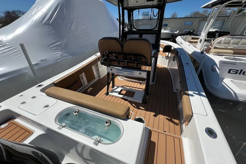 Slide: The Image of 2021 Sea Pro 239 Center Console boat interior with seating and console view. - 3