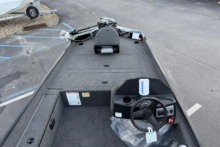 Slide: The Image of 2026 Crestliner 1700 Storm boat interior with steering wheel and control panel. - 3