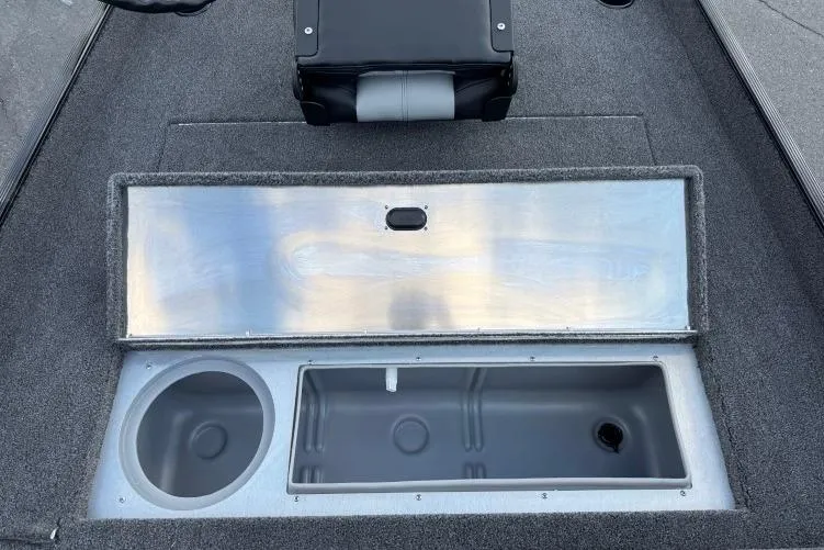 Slide: The Image of 2026 Crestliner 1700 Storm boat interior with open storage compartment and seating. - 6